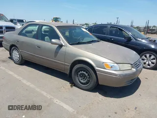 1999 Toyota Camry LE z VIN JT2BG22KXX0317947, wystawiony jako IAAI lot #42352594 z przebiegiem 192 160 mil mil oraz . Historia ofert i sprzedaży dostępna na DreamBid. Obrazek 1.