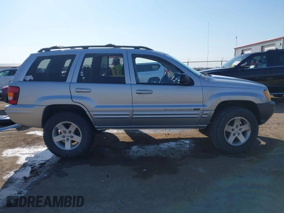 2004 Jeep Grand Cherokee Limited z VIN 1J4GW58S84C269863, wystawiony jako IAAI lot #41900325 z przebiegiem 226 587 mil mil oraz . Historia ofert i sprzedaży dostępna na DreamBid. Obrazek 14.