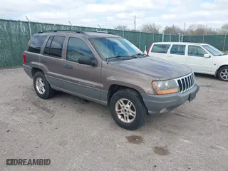 2002 Jeep Grand Cherokee Laredo with VIN 1J4GW48S32C123720, listed as a IAAI auction lot 41909204 with 157,996 mi miles. Bid and sale history available at carsss.com. Image 1.