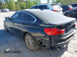 2015 BMW 4 Series 428i with VIN WBA4A5C51FG051393, listed as a IAAI auction lot 42041960 with 136,929 mi miles and . Bid and sale history available at carsss.com. Image 3.