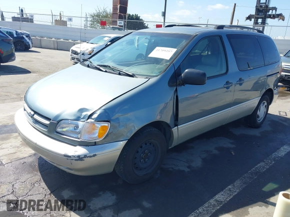1999 Toyota Sienna LE with VIN 4T3ZF13C5XU099020, listed as a IAAI auction lot 41709287 with 206,884 mi miles. Bid and sale history available at carsss.com. Image 18.