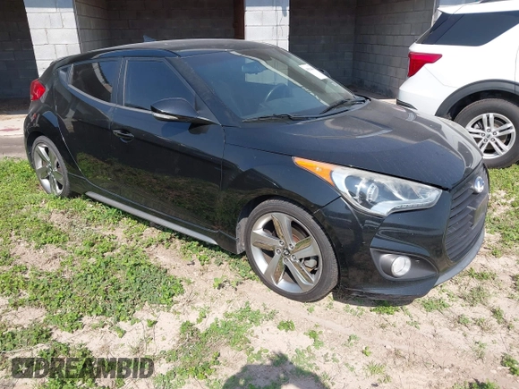 2013 Hyundai Veloster Turbo z VIN KMHTC6AE7DU124293, wystawiony jako IAAI lot #41924836 z przebiegiem 141 685 mil mil oraz . Historia ofert i sprzedaży dostępna na DreamBid. Obrazek 1.