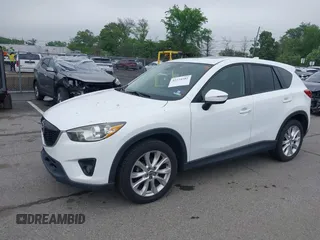 2015 Mazda CX-5 Grand Touring with VIN JM3KE4DY5F0530854, listed as a IAAI auction lot 42274582 with 144,732 mi miles and . Bid and sale history available at DreamBid. Image 2.