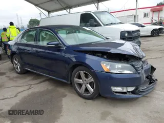 2015 Volkswagen Passat 1.8T Wolfsburg Ed with VIN 1VWAT7A32FC097106, listed as a IAAI auction lot 41913707 with 185,698 mi miles. Bid and sale history available at carsss.com. Image 1.