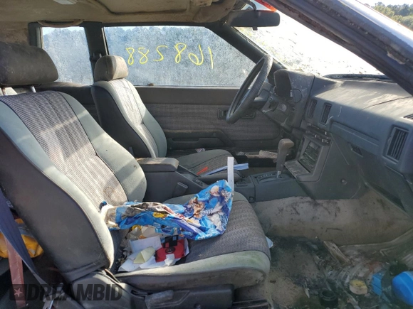1984 Toyota Celica z VIN JT2RA64C7E6218560, wystawiony jako Copart lot #63087872 z przebiegiem 168 288 mil mil oraz Czysty tytuł • Clean title. Historia ofert i sprzedaży dostępna na DreamBid. Obrazek 5.