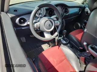 2006 MINI Hardtop S with VIN WMWRE33556TJ38543, listed as a Copart auction lot 62420145 with 105,656 mi miles and Salvage title. Bid and sale history available at DreamBid. Image 8.