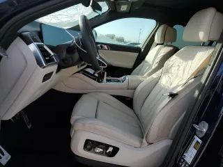 2025 BMW X6 M60i with VIN 5UX43EX01S9X19069, listed as a Copart auction lot 42613105 with 6,909 mi miles and Salvage Title. Bid and sale history available at carsss.com. Image 7.