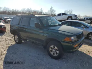 1999 Mitsubishi Montero LS z VIN JA4LS31H5XP033598, wystawiony jako Copart lot #85609464 z przebiegiem 185 686 mil mil oraz Szkoda całkowita • Salvage title. Historia ofert i sprzedaży dostępna na DreamBid. Obrazek 4.