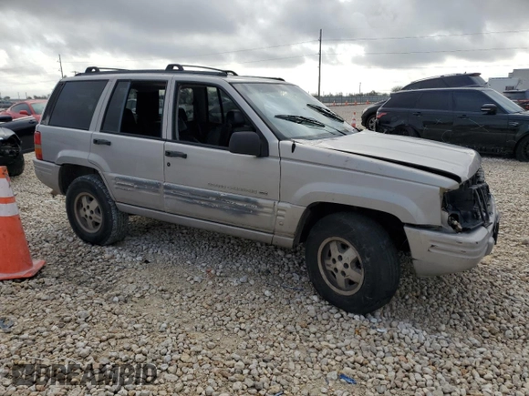 1998 Jeep Grand Cherokee with VIN 1J4FX48S6WC345358, listed as a Copart auction lot 85057454 with Not provided miles and Salvage title. Bid and sale history available at DreamBid. Image 4.