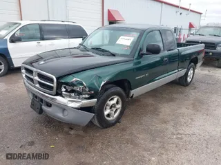 1998 Dodge Dakota SLT with VIN 1B7GL22Y8WS722611, listed as a IAAI auction lot 40964684 with 213,429 mi miles. Bid and sale history available at carsss.com. Image 2.