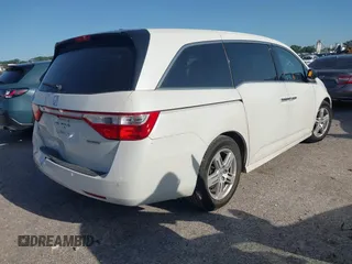 2012 Honda Odyssey Touring with VIN 5FNRL5H93CB125241, listed as a IAAI auction lot 42299053 with 125,549 mi miles and . Bid and sale history available at DreamBid. Image 4.
