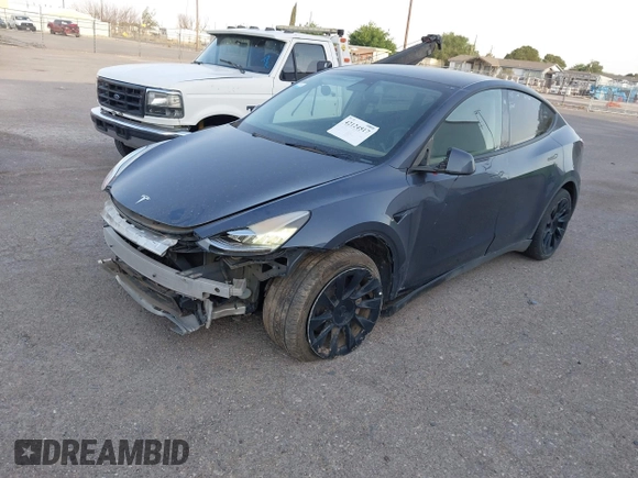 2023 Tesla Model Y Long Range with VIN 7SAYGDEE1PA053683, listed as a IAAI auction lot 42124517 with 32,295 mi miles. Bid and sale history available at carsss.com. Image 18.