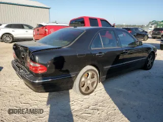 2002 Mercedes-Benz E-Class with VIN WDBJF65J32B494321, listed as a Copart auction lot 77557334 with 198,820 mi miles and Salvage Title. Bid and sale history available at carsss.com. Image 3.