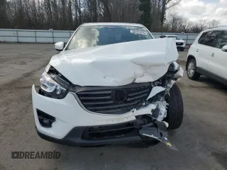 2016 Mazda CX-5 Grand Touring z VIN JM3KE2DY9G0645141, wystawiony jako Copart lot #50989635 z przebiegiem 123 898 mil mil oraz Szkoda całkowita • Salvage title. Historia ofert i sprzedaży dostępna na DreamBid. Obrazek 5.