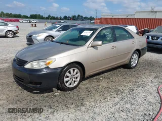 2004 Toyota Camry LE with VIN 4T1BF30K24U570599, listed as a IAAI auction lot 42107715 with 324,191 mi miles and . Bid and sale history available at DreamBid. Image 2.