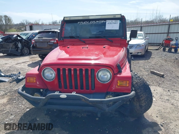 2002 Jeep Wrangler Sport with VIN 1J4FA49S42P771262, listed as a IAAI auction lot 41819403 with 132,871 mi miles. Bid and sale history available at carsss.com. Image 13.
