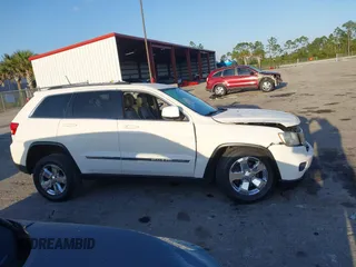 2011 Jeep Grand Cherokee Laredo with VIN 1J4RS4GGXBC739433, listed as a IAAI auction lot 41794031 with 174,672 mi miles and . Bid and sale history available at DreamBid. Image 14.