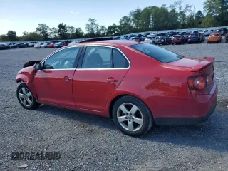 2009 Volkswagen Jetta SE with VIN 3VWRZ71K69M177746, listed as a Copart auction lot 70990074 with 128,390 mi miles and Salvage title. Bid and sale history available at DreamBid. Image 2.