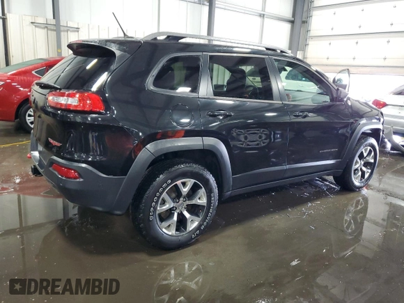 2014 Jeep Cherokee Trailhawk with VIN 1C4PJMBSXEW187981, listed as a Copart auction lot 56711885 with 157,317 mi miles and Salvage title. Bid and sale history available at DreamBid. Image 3.