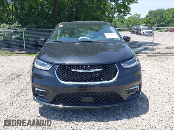 2023 Chrysler Pacifica Touring L with VIN 2C4RC1BG1PR606504, listed as a IAAI auction lot 42647652 with 41,598 mi miles and . Bid and sale history available at DreamBid. Image 13.