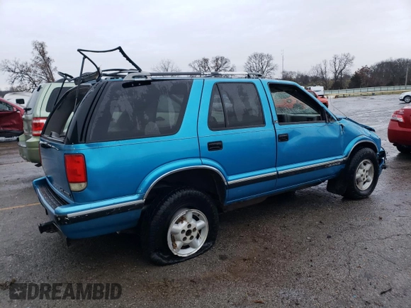 1995 Chevrolet Blazer z VIN 1GNDT13W4S2154787, wystawiony jako Copart lot #85719274 z przebiegiem 167 242 mil mil oraz Nie do naprawy • Non repairable. Historia ofert i sprzedaży dostępna na DreamBid. Obrazek 3.