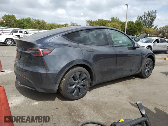 2025 Tesla Model Y Long Range with VIN 7SAYGDED6SF228626, listed as a Copart auction lot 47654525 with 2,087 mi miles and Salvage Title. Bid and sale history available at DreamBid. Image 3.