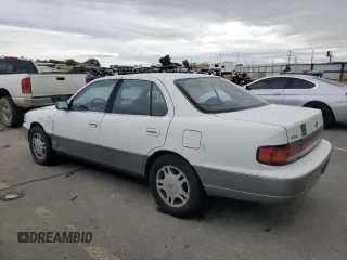 1994 Toyota Camry XLE with VIN JT2GK13E5R0008509, listed as a Copart auction lot 76014164 with 188,427 mi miles and Salvage Title. Bid and sale history available at carsss.com. Image 2.