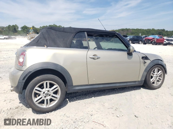 2011 MINI Convertible with VIN WMWZN3C54BT133246, listed as a Copart auction lot 69780074 with 176,955 mi miles and Salvage title. Bid and sale history available at DreamBid. Image 3.