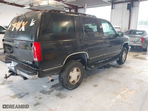 1996 GMC Yukon with VIN 1GKEK13R2TJ743987, listed as a IAAI auction lot 41652826 with 325,292 mi miles. Bid and sale history available at carsss.com. Image 4.