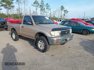1999 Toyota Tacoma with VIN 4TAPM62NXXZ439318, listed as a IAAI auction lot 41721442 with 299,876 mi miles and . Bid and sale history available at DreamBid. Image 1.