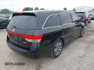 2015 Honda Odyssey Touring Elite with VIN 5FNRL5H97FB124565, listed as a IAAI auction lot 42358412 with 206,444 mi miles and . Bid and sale history available at DreamBid. Image 4.