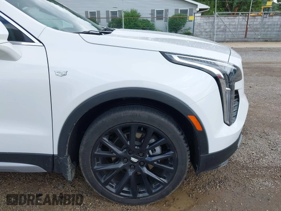 2022 Cadillac XT4 AWD Premium Luxury z VIN 1GYFZDR42NF128199, wystawiony jako IAAI lot #42522314 z przebiegiem 29 002 mil mil oraz . Historia ofert i sprzedaży dostępna na DreamBid. Obrazek 18.