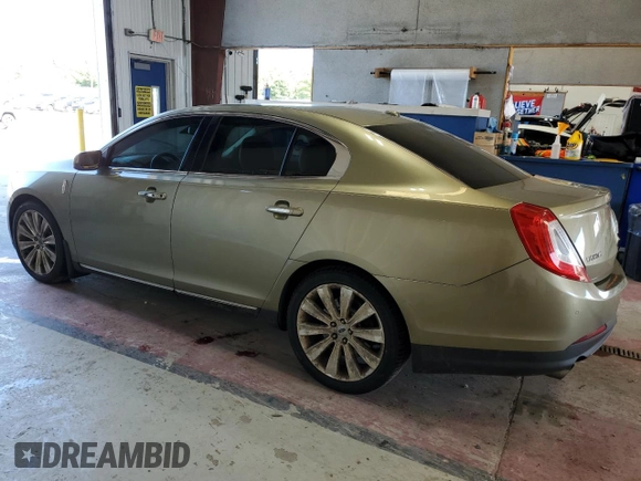 2013 Lincoln MKS EcoBoost with VIN 1LNHL9FT2DG604657, listed as a Copart auction lot 65357735 with 133,548 mi miles and Salvage title. Bid and sale history available at DreamBid. Image 2.