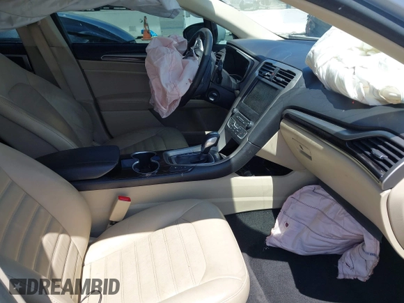 2016 Ford Fusion Energi SE Luxury with VIN 3FA6P0PU7GR206589, listed as a IAAI auction lot 42002565 with 215,789 mi miles. Bid and sale history available at carsss.com. Image 5.