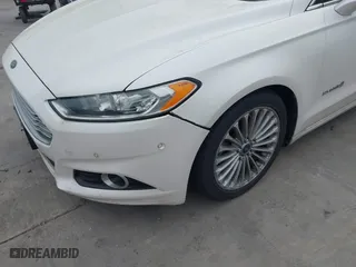 2014 Ford Fusion Titanium Hybrid with VIN 3FA6P0RU6ER115985, listed as a IAAI auction lot 41870494 with 132,321 mi miles. Bid and sale history available at carsss.com. Image 6.