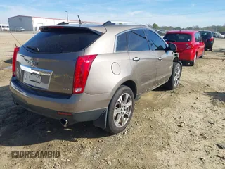 2012 Cadillac SRX Performance Collection with VIN 3GYFNBE3XCS565616, listed as a IAAI auction lot 41835476 with 141,259 mi miles. Bid and sale history available at carsss.com. Image 4.