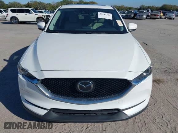 2020 Mazda CX-5 Touring with VIN JM3KFACM6L0737727, listed as a IAAI auction lot 41283200 with 85,949 mi miles and . Bid and sale history available at carsss.com. Image 12.
