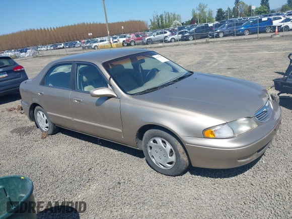 1999 Mazda 626 ES z VIN 1YVGF22C5X5811946, wystawiony jako IAAI lot #41970165 z przebiegiem 126 709 mil mil oraz . Historia ofert i sprzedaży dostępna na DreamBid. Obrazek 1.
