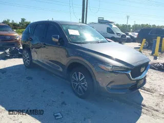 2018 Mazda CX-5 Grand Touring with VIN JM3KFBDM8J0314925, listed as a IAAI auction lot 41825917 with 70,027 mi miles. Bid and sale history available at carsss.com. Image 1.