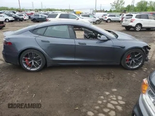 2022 Tesla Model S Plaid with VIN 5YJSA1E63NF460223, listed as a Copart auction lot 56127155 with 50,419 mi miles and Clean title. Bid and sale history available at DreamBid. Image 4.