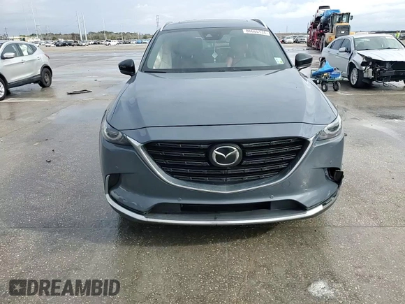 2021 Mazda CX-9 Grand Touring z VIN JM3TCADYXM0519757, wystawiony jako Copart lot #86665134 z przebiegiem 51 217 mil mil oraz Szkoda całkowita • Salvage title. Historia ofert i sprzedaży dostępna na DreamBid. Obrazek 12.