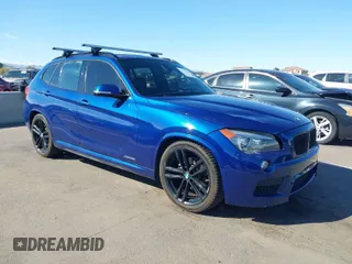 2015 BMW X1 xDrive28i with VIN WBAVL1C56FVY32753, listed as a IAAI auction lot 41759454 with 130,823 mi miles. Bid and sale history available at carsss.com. Image 1.