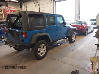 2015 Jeep Wrangler Unlimited Rubicon with VIN 1C4BJWFG7FL661643, listed as a IAAI auction lot 41291385 with 112,785 mi miles. Bid and sale history available at carsss.com. Image 4.