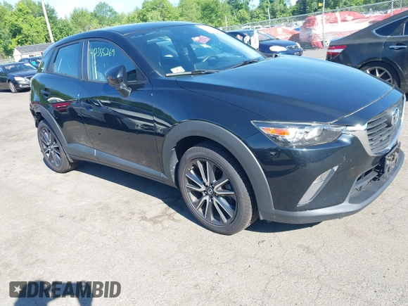 2018 Mazda CX-3 Touring z VIN JM1DKFC73J0321605, wystawiony jako IAAI lot #42355269 z przebiegiem 40 053 mil mil oraz . Historia ofert i sprzedaży dostępna na DreamBid. Obrazek 1.