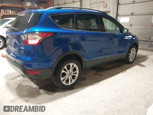 2017 Ford Escape SE with VIN 1FMCU0GD7HUB99218, listed as a IAAI auction lot 41941432 with 92,090 mi miles and . Bid and sale history available at DreamBid. Image 4.