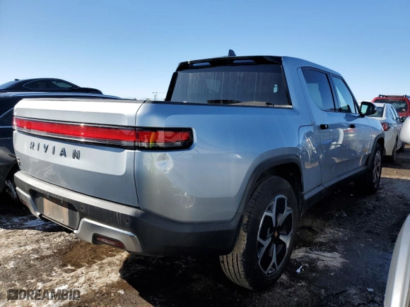 2023 Rivian R1T Adventure with VIN 7FCTGAAA5PN017311, listed as a Copart auction lot 42523755 with 35,039 mi miles and Salvage Title. Bid and sale history available at carsss.com. Image 3.