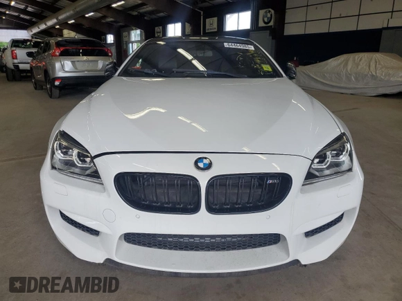2014 BMW M6 z VIN WBSLX9C58ED160480, wystawiony jako Copart lot #64464985 z przebiegiem 58 514 mil mil oraz Czysty tytuł • Clean title. Historia ofert i sprzedaży dostępna na DreamBid. Obrazek 5.