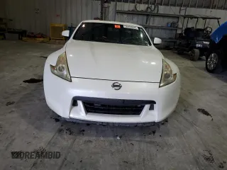 2012 Nissan 370Z z VIN JN1AZ4EH3CM565276, wystawiony jako Copart lot #56654845 z przebiegiem 77 788 mil mil oraz Nie do naprawy. Historia ofert i sprzedaży dostępna na DreamBid. Obrazek 5.