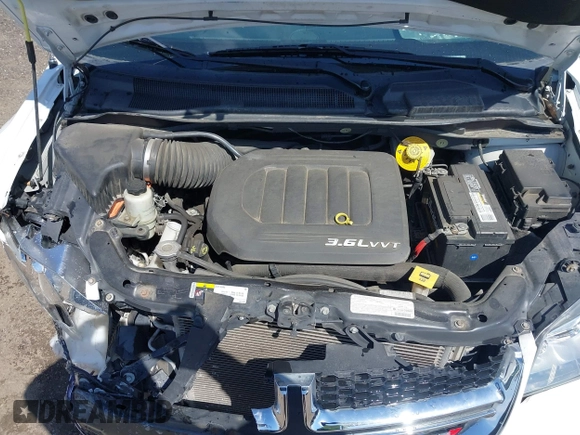 2014 Dodge Grand Caravan SXT with VIN 2C4RDGCG6ER361842, listed as a IAAI auction lot 41827951 with 100,845 mi miles and . Bid and sale history available at DreamBid. Image 10.