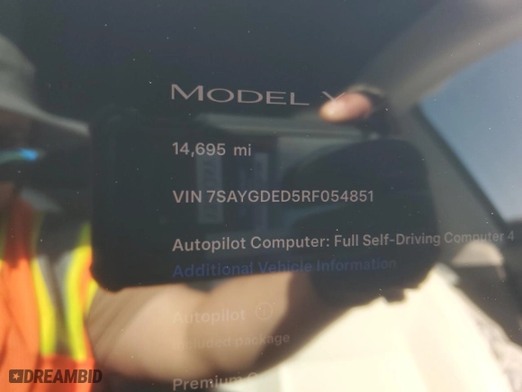 2024 Tesla Model Y with VIN 7SAYGDED5RF054851, listed as a Copart auction lot 42835055 with 14,695 mi miles and Salvage Title. Bid and sale history available at carsss.com. Image 9.